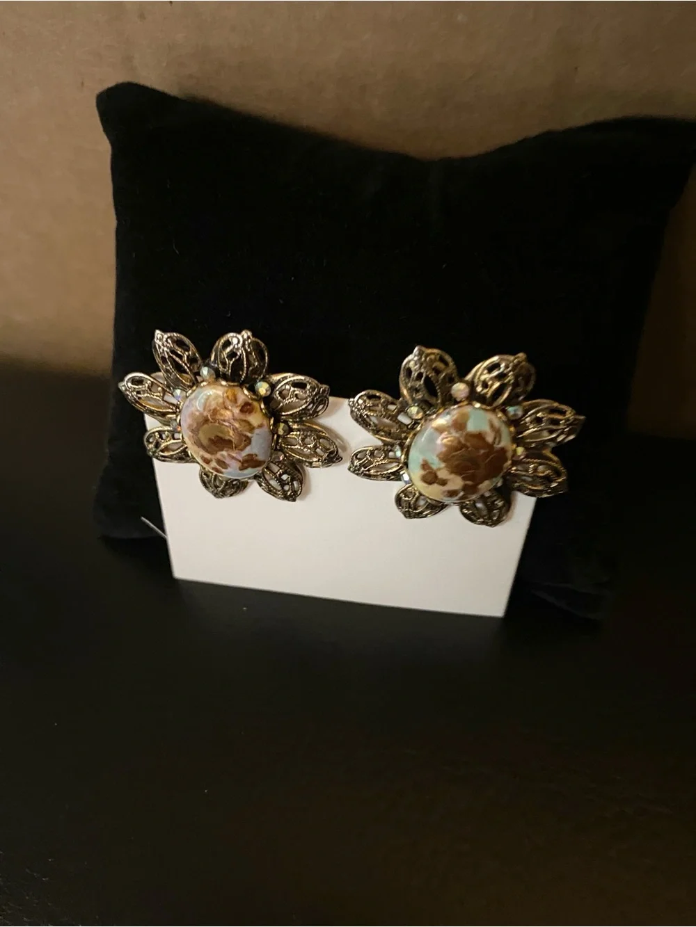 Gold-Tone Floral Filigree Clip Earrings with Brown Resin Center